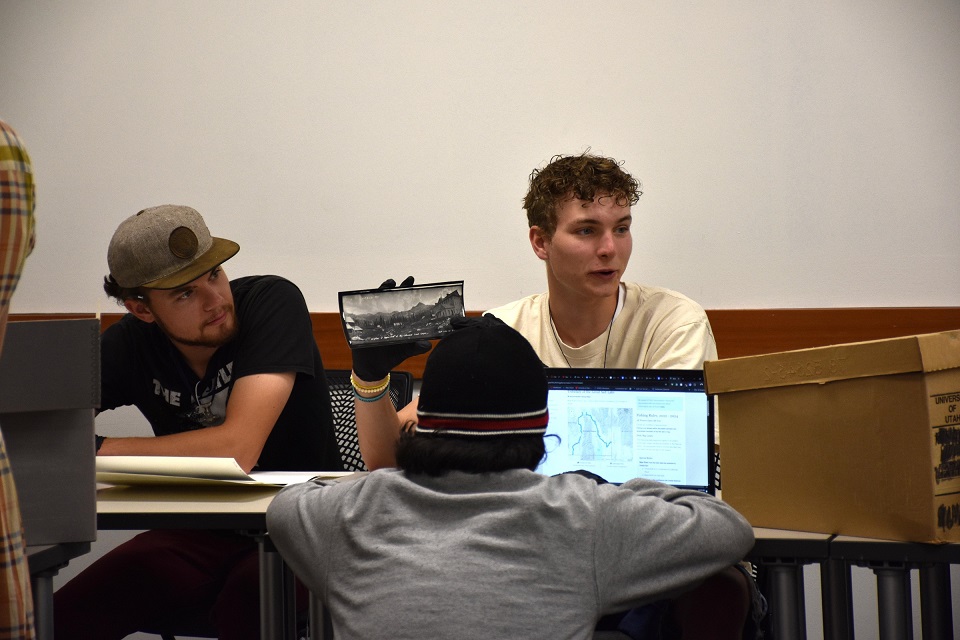 Students look through archival library records