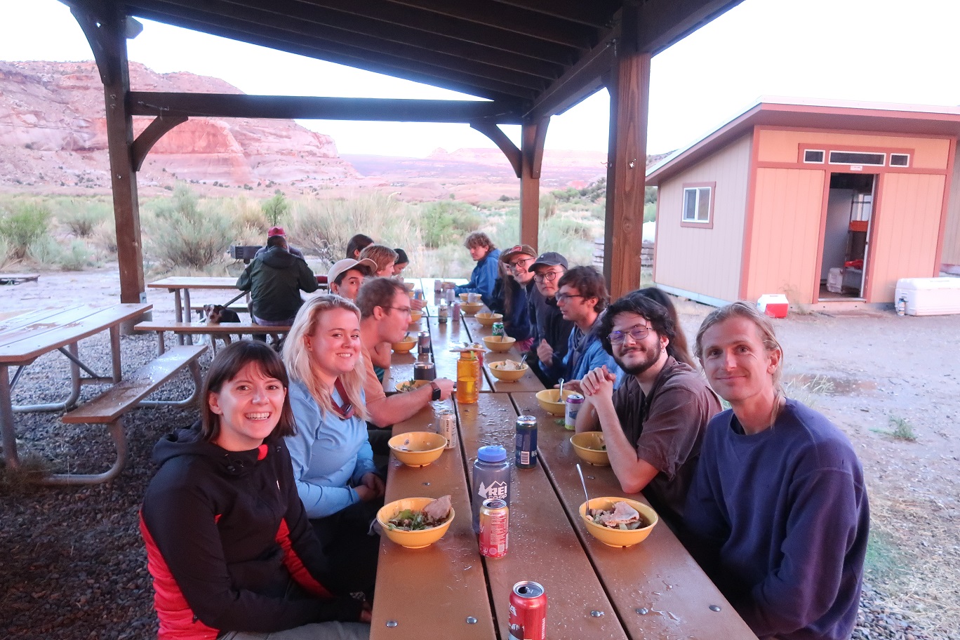 Graduate students eating at a table