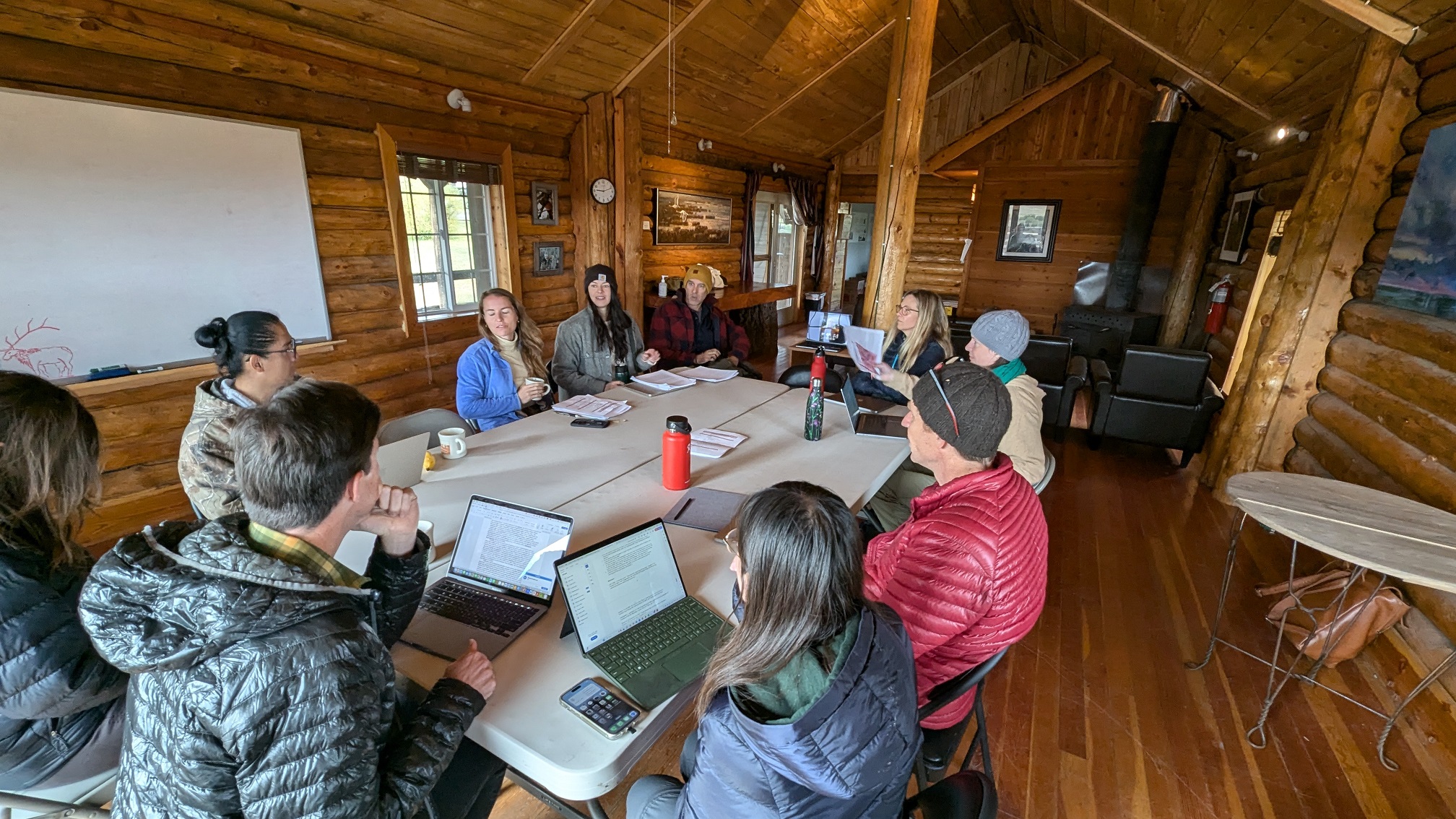 Writing retreat participants sitting around a table