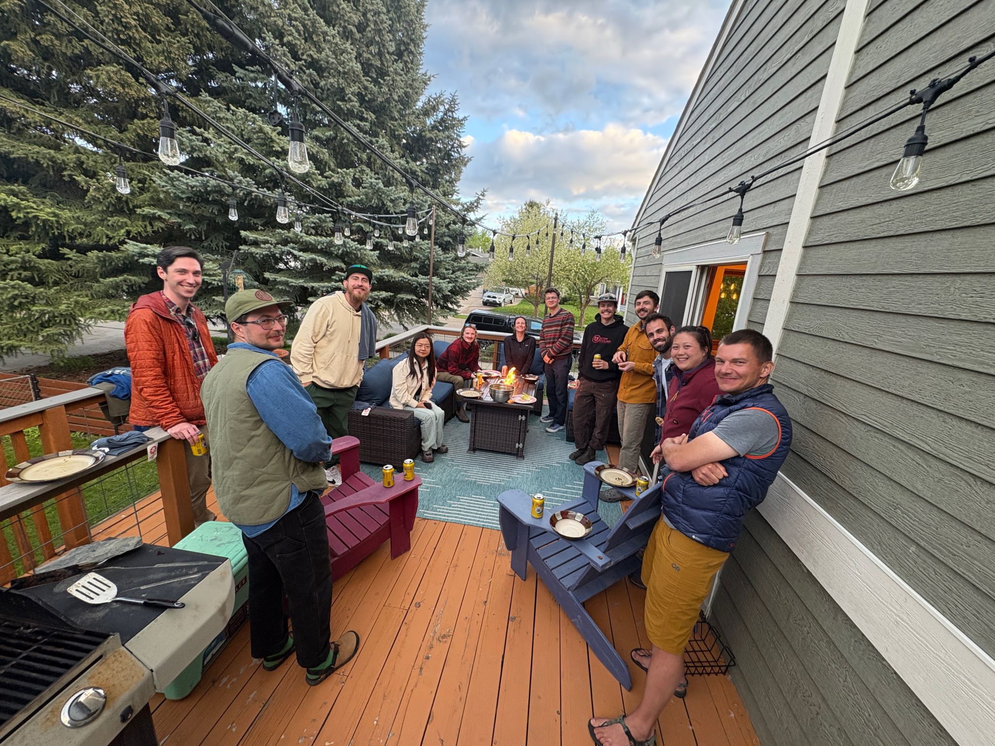 Lab members stand on porch 