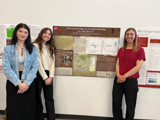 Students in front of research poster